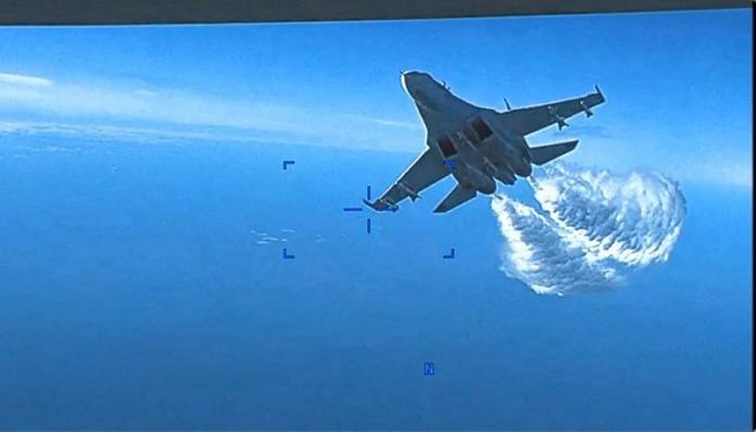A Russian Su-27 aircraft dumps fuel while flying upon a U.S. Air Force intelligence, surveillance, and reconnaissance unmanned MQ-9 aircraft over the Black Sea on 14 March 2023 | Photo: U.S. Air Force/Handout via REUTERS