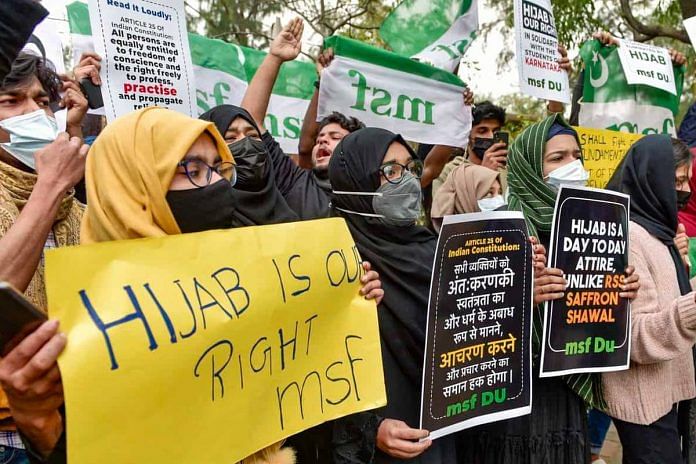 Delhi University Muslim Students’ Federation activists hold placards during a protest in New Delhi over the hijab controversy in Karnataka in 2022 | Representative image | Photo: PTI