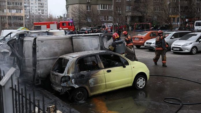 Emergency workers extinguish fire in vehicles at the site of a Russian missile strike, amid Russia's attack on Ukraine, in Kyiv, Ukraine on 9 March, 2023 | Reuters