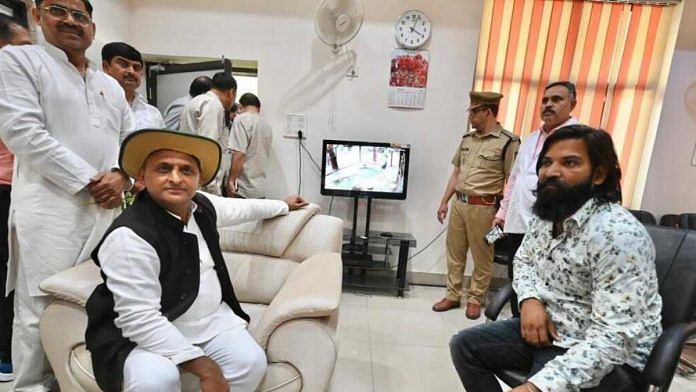 Akhilesh Yadav and Muhammad Arif surrounded by SP workers and zoo officials watching the sarus on CCTV | Special arrangement