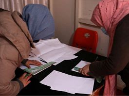 File photo of Afghan women draw sewing patterns on paper at a sewing workshop in Kabul, Afghanistan 15 January, 2022 | Reuters