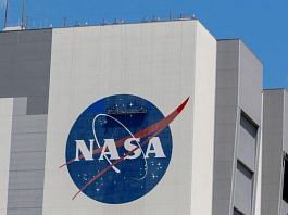 File photo of workers pressure wash the logo of NASA on the Vehicle Assembly Building at the Kennedy Space Center in Cape Canaveral, Florida, 19 May, 2020 | Reuters