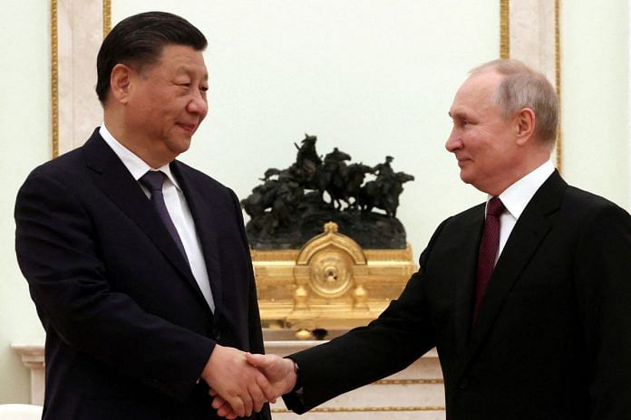 Russian President Vladimir Putin shakes hands with Chinese President Xi Jinping during a meeting at the Kremlin in Moscow, Russia, March 20, 2023 | Reuters