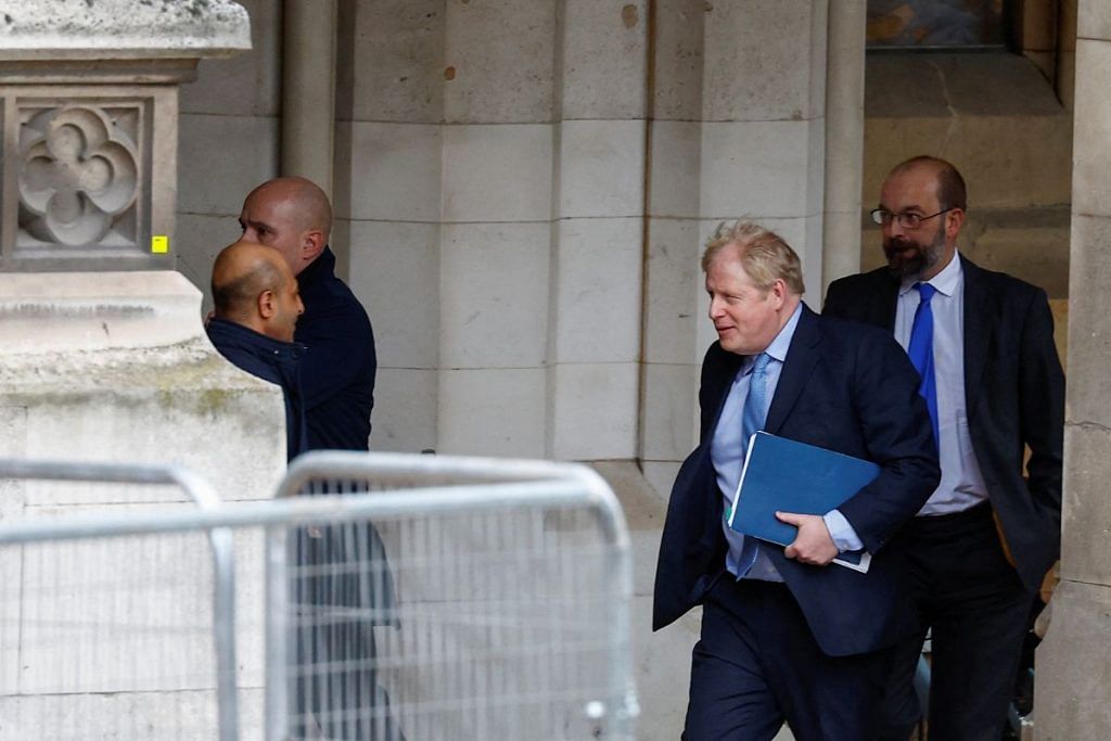 Former British Prime Minister Boris Johnson walks at the parliament in London, Britain, 22 March, 2023 | Reuters
