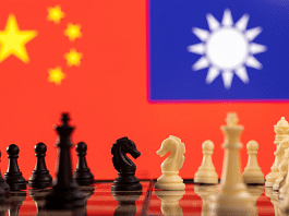 FILE PHOTO: Chess pieces are seen in front of displayed China and Taiwan's flags in this illustration taken January 25, 2022. REUTERS/Dado Ruvic/Illustration