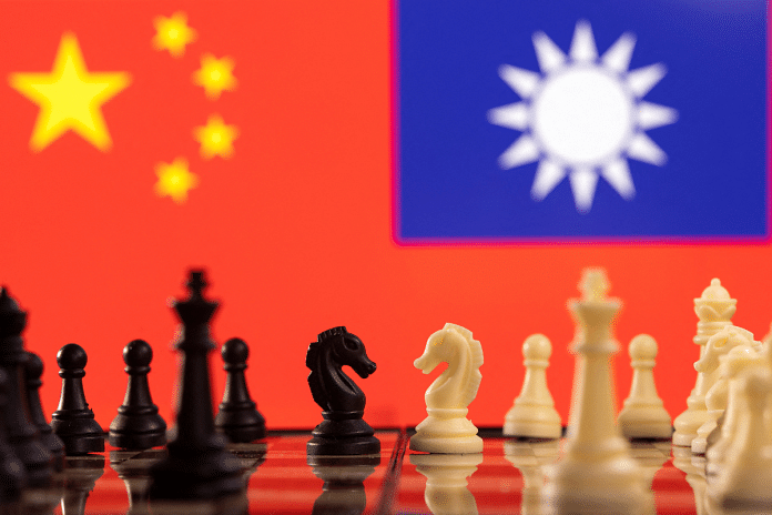 FILE PHOTO: Chess pieces are seen in front of displayed China and Taiwan's flags in this illustration taken January 25, 2022. REUTERS/Dado Ruvic/Illustration
