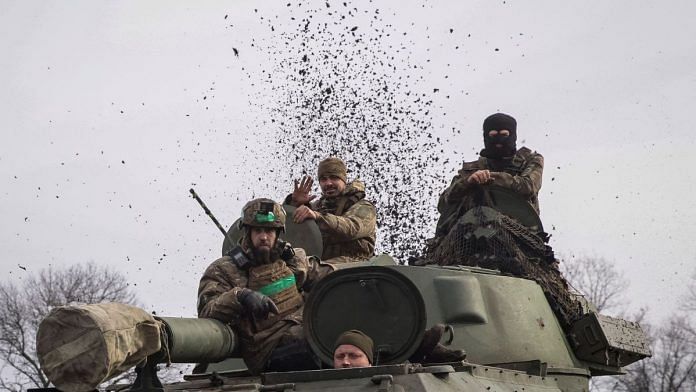 File photo of Ukrainian service members riding a self-propelled howitzer, as Russia's attack on Ukraine continues, near the frontline city of Bakhmut, Ukraine on 27 February, 2023 | Reuters