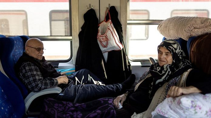 Arafat Ates, 63, and his wife Zeliha Ates, 53, sit in a train at Iskenderun station, where train carriages have been turned into temporary shelters for victims of the recent deadly earthquake, in Iskenderun, Turkey, on 15 February, 2023 | Reuters