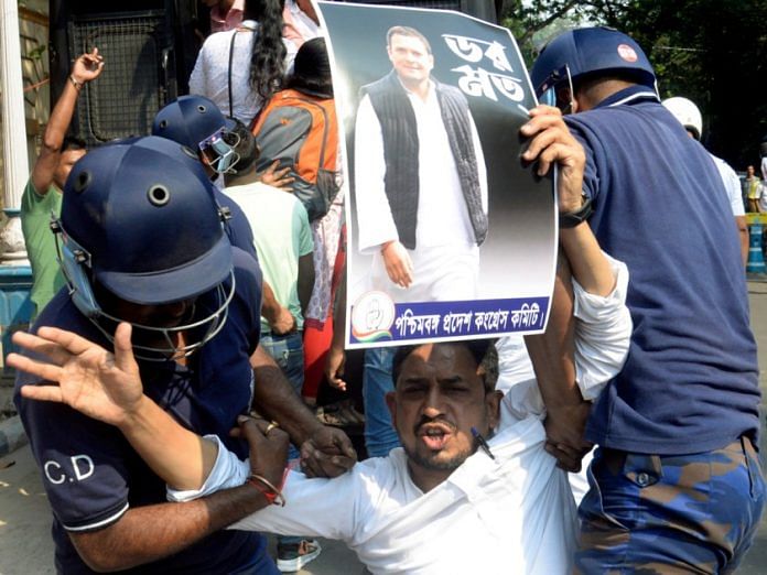 Police detain Congress supporters during a protest over the conviction of party MP Rahul Gandhi in a 2019 criminal defamation case in Kolkata | ANI