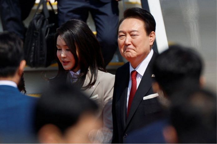 South Korea's President Yoon Suk Yeol and his wife Kim Keon-hee arrive at Tokyo International Airport (Haneda Airport) in Tokyo, Japan March 16, 2023 | Reuters