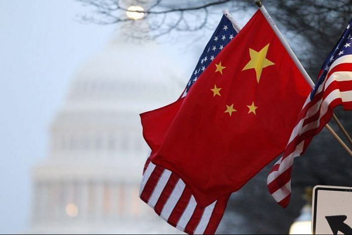 The People's Republic of China flag and the U.S. Stars and Stripes fly along Pennsylvania Avenue near the U.S. Capitol in Washington | File Photo: Reuters