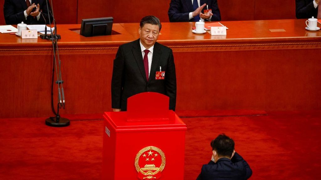 Chinese President Xi Jinping looks on after casting his vote during the Third Plenary Session of the National People's Congress (NPC) at the Great Hall of the People, in Beijing, China, 10 March 2023. MARK R. CRISTINO/Pool via REUTERS