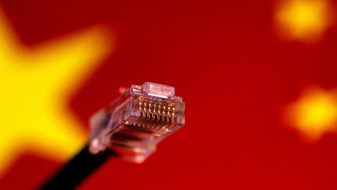 FILE PHOTO: Illustration photo of a computer network cable above a Chinese flag A computer network cable is seen above a Chinese flag. Photo: Reuters File