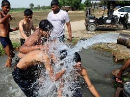 File photo of a group of Delhi residents splashing water on themselves during a heatwave | Photo: Suraj Singh Bisht/ThePrint
