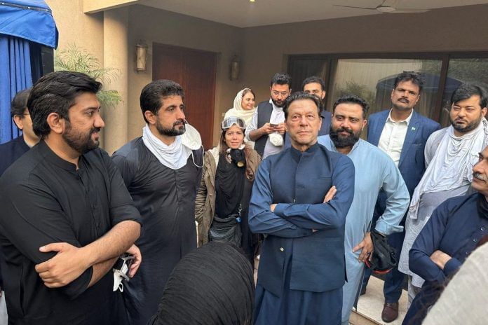 Former Pakistani PM Imran Khan stands with supporters in Lahore's Zaman Park| Musa Virk Via Twitter/via Reuters