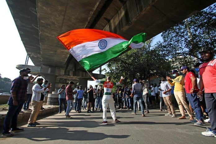 indian flag A cricket fan holds an Indian flag | Representational iage | ANI file photo