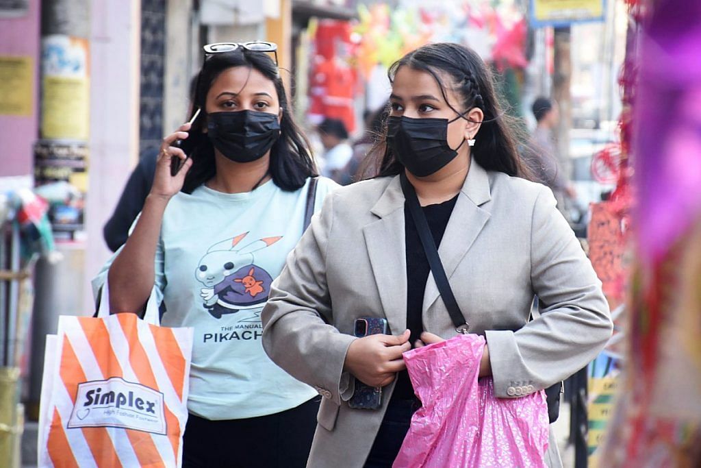Representational image of shoppers wearing masks at a market in Guwahati | ANI file photo
