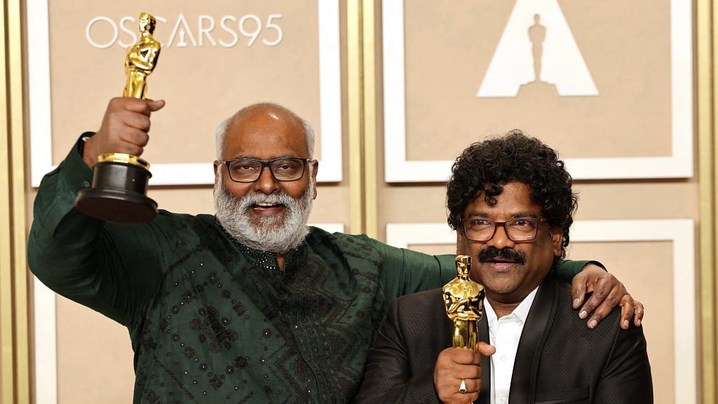 M.M. Keeravaani and Chandrabose pose with the Oscar for Best Original Song for "Naatu Naatu" from "RRR" in the Oscars photo room at the 95th Academy Awards in Hollywood, Los Angeles, California on 12 March 2023 | Photo: REUTERS