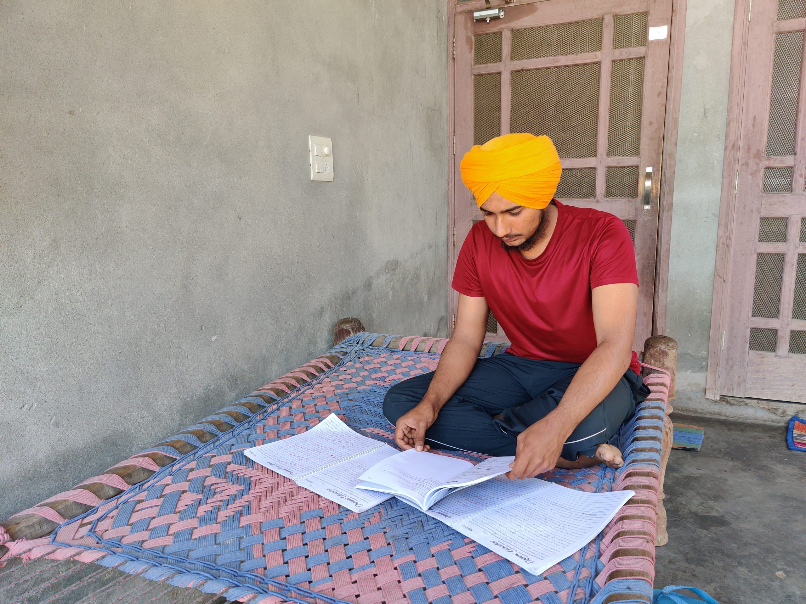 Parminder Singh prepares for the IELTS exam at his home in a village in Amritsar   | Sonal Matharu | ThePrint