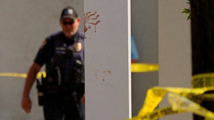 A bloody handprint marks a pillar the day after a shooting during a teenager's birthday party at Mahogany Masterpiece Dance Studio in Dadeville, Alabama, US | Reuters