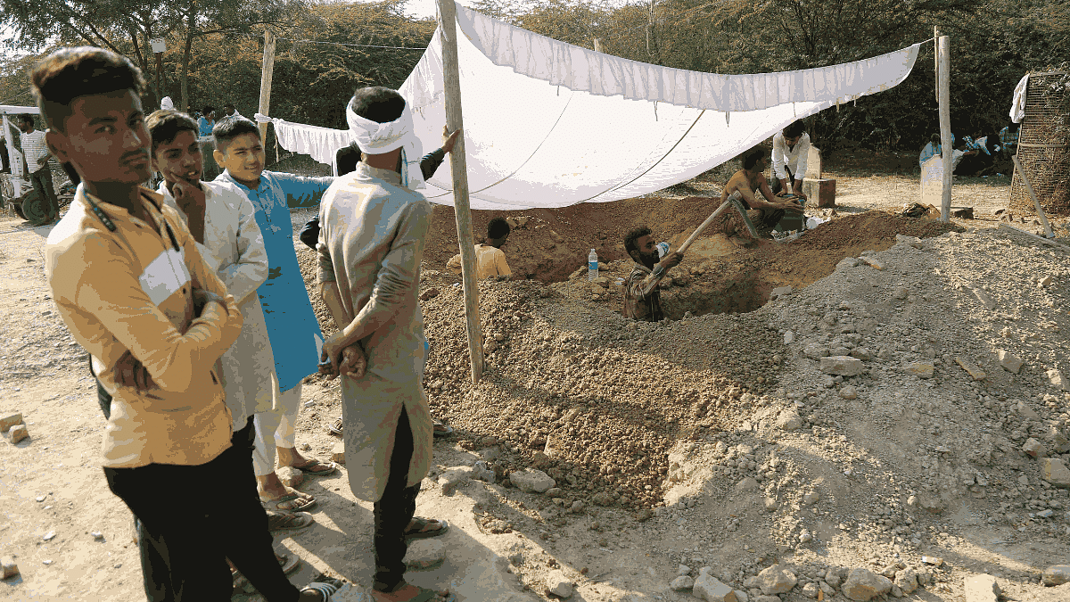 The graves being dug at the Kasari Masari burial ground Sunday | Suraj Singh Bisht | ThePrint