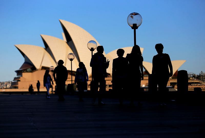 People walk in front of the Sydney Opera House, Australia | Reuters File Photo