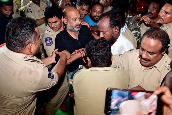 Cops arresting Telangana BJP chief Bandi Sanjay Kumar in Karimnagar Wednesday | ANI