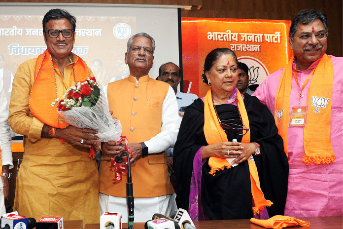 Rajasthan BJP President C.P. Joshi is welcomed by party MP Om Prakash Mathur and party national vice-president Vasundhara Raje during the Legislature Party meeting, in Jaipur on 2 April | ANI