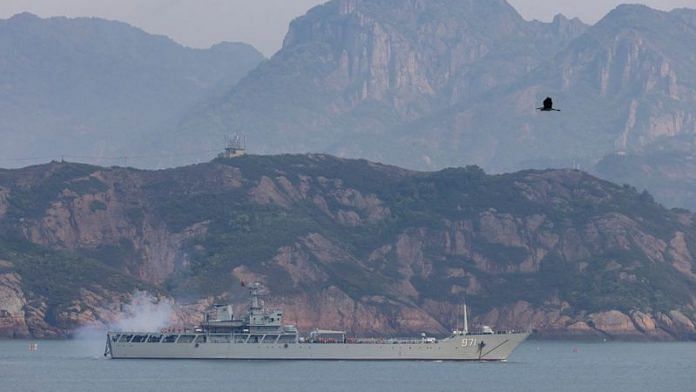 A Chinese warship fires during a military drill off the Chinese coast near Fuzhou, Fujian Province, across from the Taiwan-controlled Matsu Islands, China, on 11 April, 2023 | Reuters