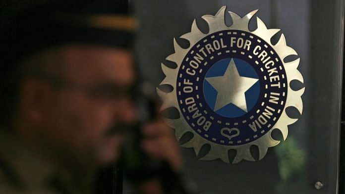 A policeman walks past a logo of the BCCI during a governing council meeting of the IPL at BCCI headquarters in Mumbai | File Photo: Reuters