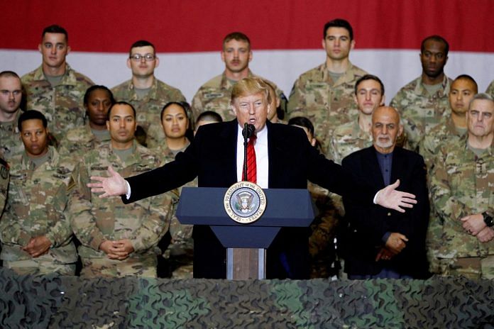 Former US president Donald Trump delivers remarks to the troops, with ex-Afghan president Ashraf Ghani standing behind him | Reuters file photo