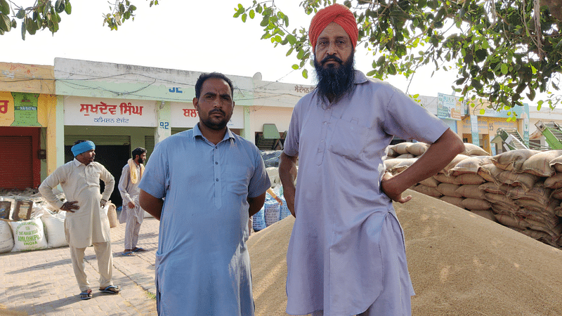Wheat farmers Harjinder Singh and Bahadur Singh ((Left to right) at Moga mandi | Sonal Matharu | ThePrint