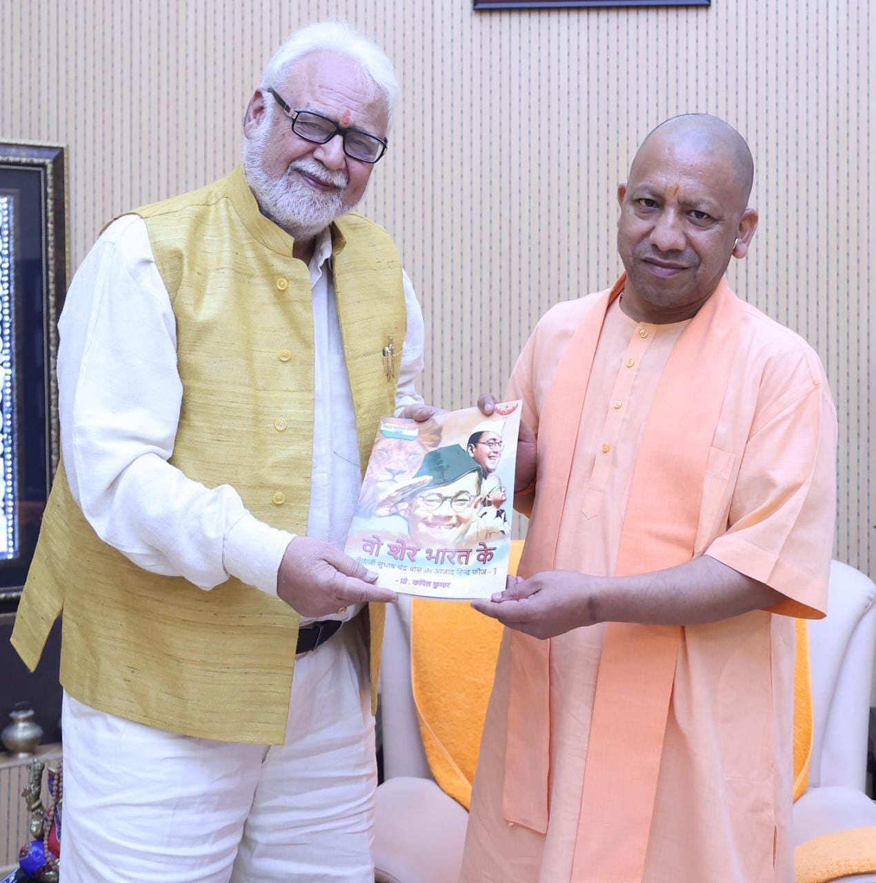 Kapil Kumar presents his book The Lions of Bharat: Netaji Subhas Chandra Bose & INA to UP CM Yogi Adityanath | Twitter | @ProfKapilKumar