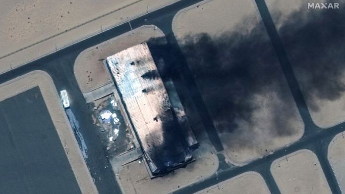 Satellite image shows a closer view of a burning building at the Merowe Airbase, Sudan, on 18 April, 2023 | Reuters