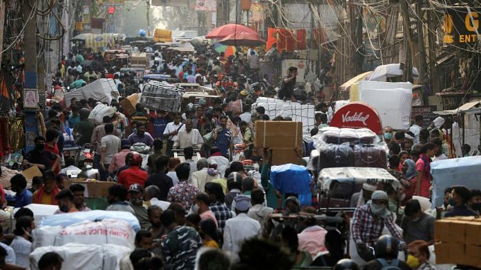 People walk at a crowded market in the old quarters of Delhi | Reuters file photo