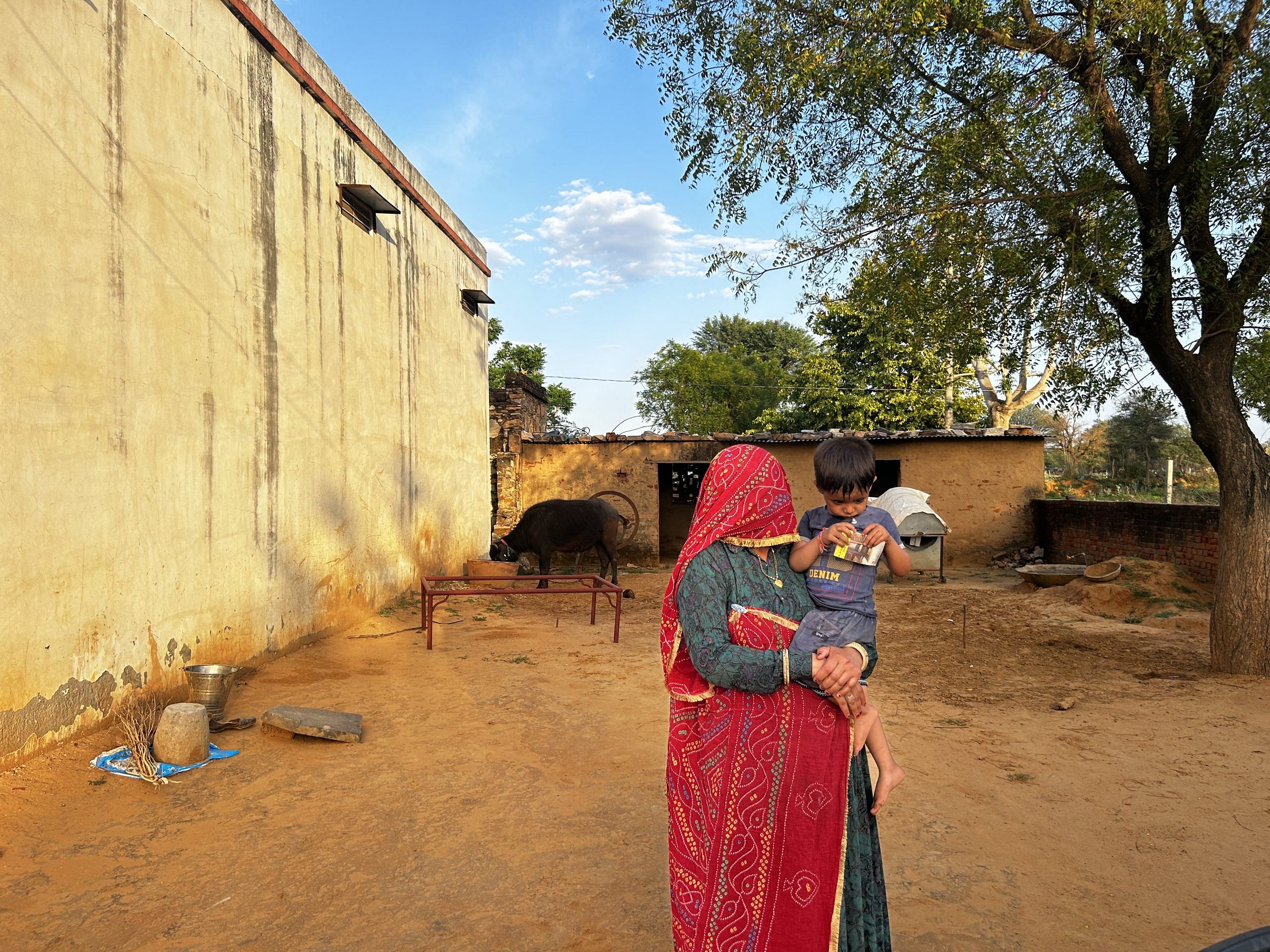 Hansa with her son in Govindpura Basri village | Jyoti Yadav, ThePrint