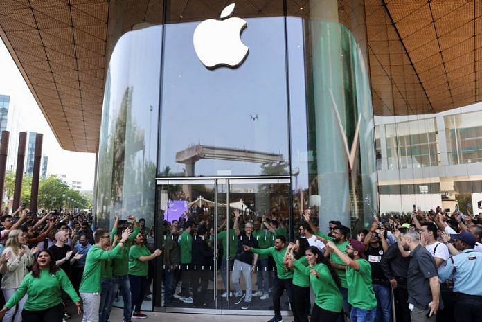 Apple CEO Tim Cook greets people at the inauguration of India's first Apple retail store in Mumbai, on 18 April 2023 | Reuters