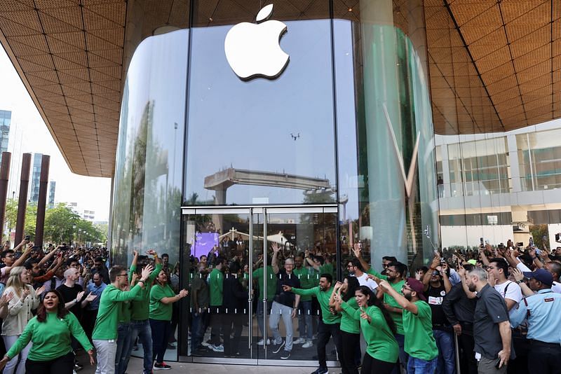 Apple CEO Tim Cook greets people at the inauguration of India's first Apple retail store in Mumbai, on 18 April 2023 | Reuters