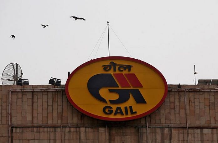 Birds fly past the logo of state-owned natural gas utility GAIL (India) Ltd installed on its corporate office building in New Delhi | Reuters