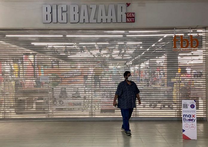A man walks past a Future Retail's closed Big Bazaar retail store in Ahmedabad | Reuters file photo