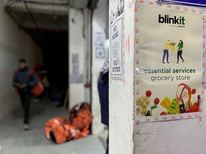 A delivery person leaves a dark store of the SoftBank-funded Blinkit in New Delhi | Reuters file photo