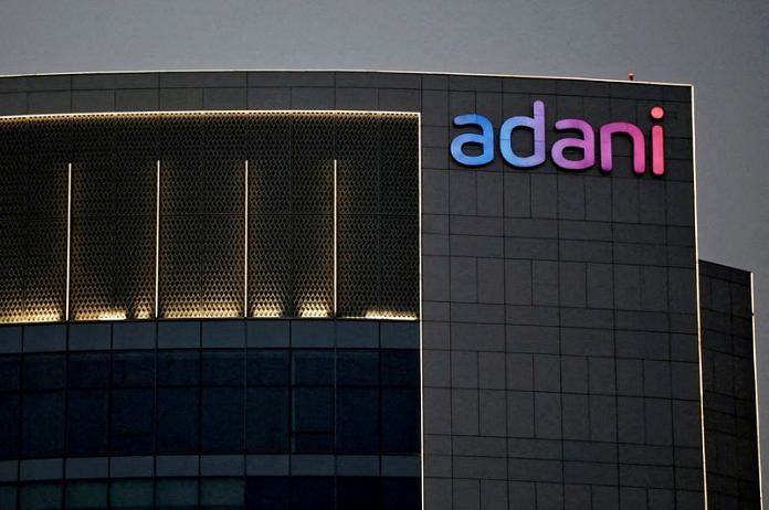 The logo of the Adani group is seen on the facade of one of its buildings on the outskirts of Ahmedabad | Reuters
