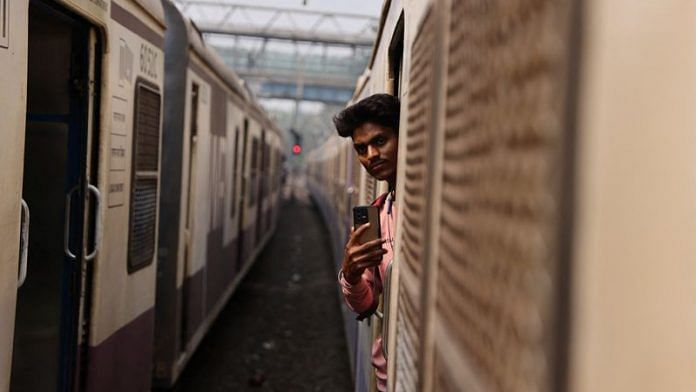 A 21-year-old aspiring college student and migrant worker Sujeet Kumar shoots a video on his mobile phone while on a local train in Mumbai | File Photo: Reuters