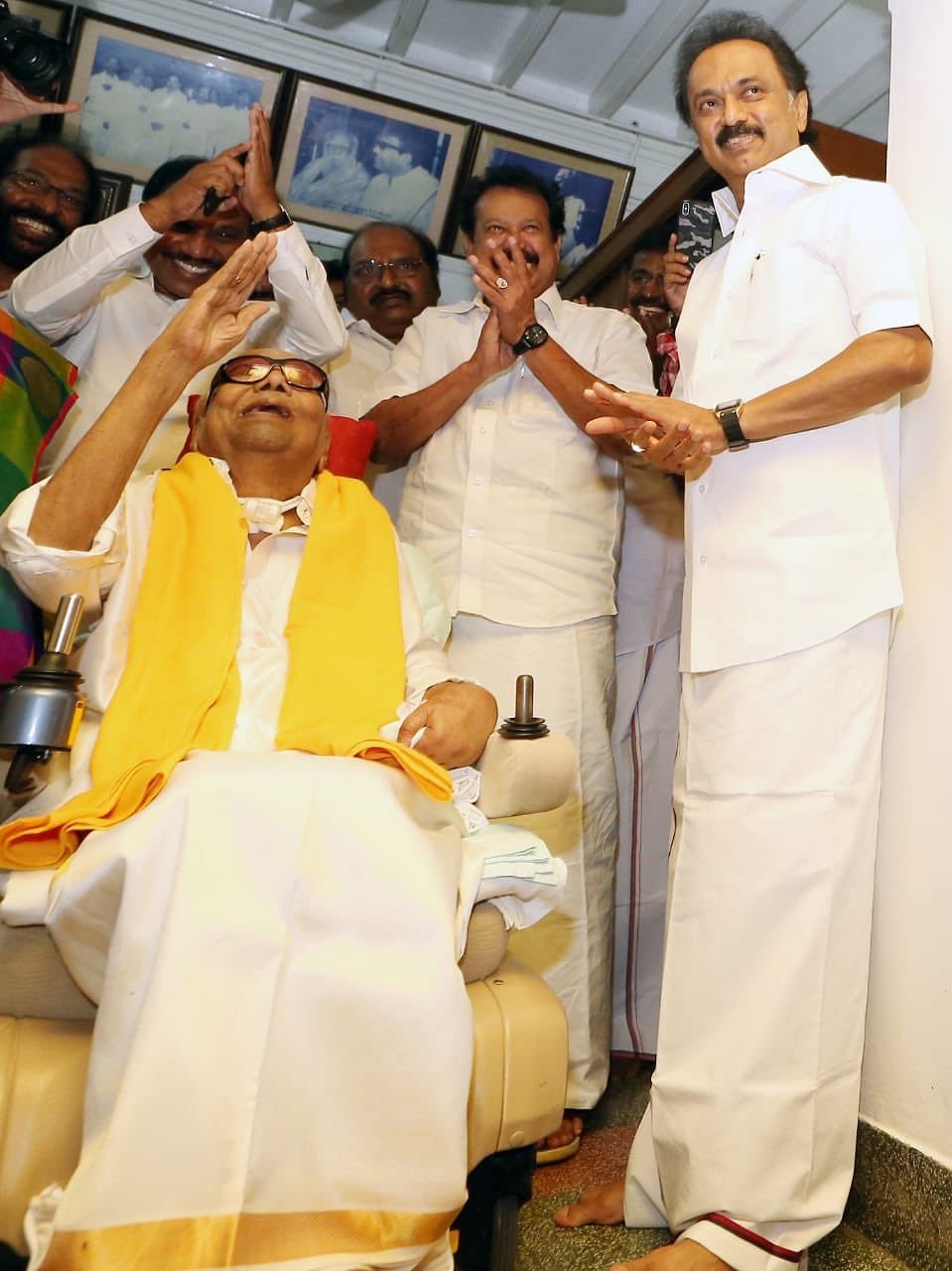 DMK patriarch M. Karunanidhi greets supporters on his 94th birthday, in June 2018. Son Stalin is also seen in the photo | Twitter | @kalaignar89