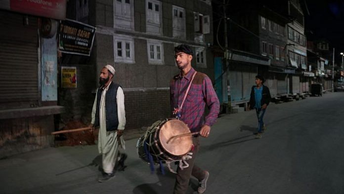 Arif Ahmad Jinded, 18, a Kashmiri Ramadan drummer locally known as 