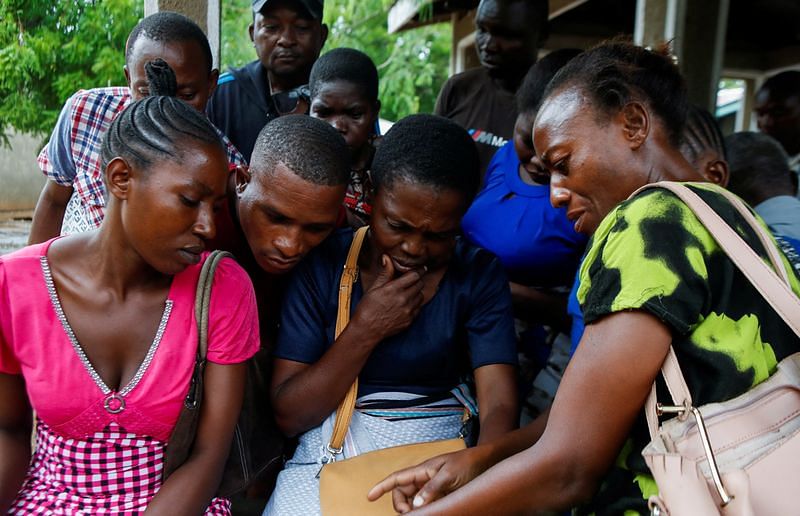 Relatives of followers of a Christian cult named 'Good News International Church' gather at the Malindi sub-district hospital mortuary in Malindi, Kilifi county, Kenya, on 26 April 2023 | Reuters