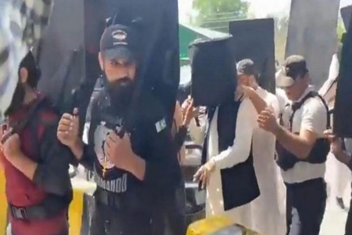 Imran Khan walks into Lahore court with bulletproof helmet | via Twitter