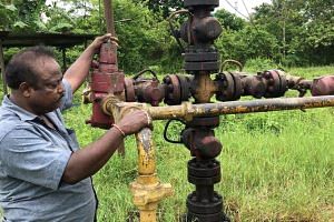 Oilman at work in Assam's Dibrugarh | district | Picture credit: Ranmoy Sharma