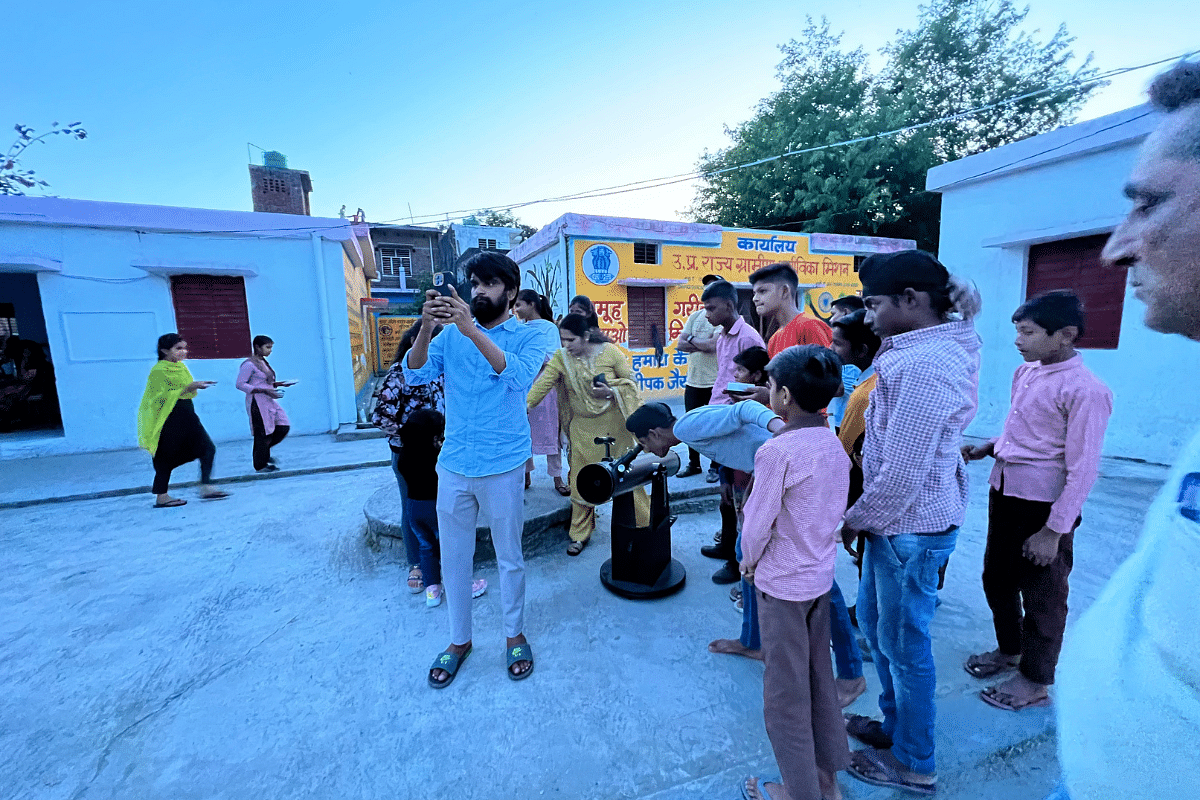 Aryan Mishra and students of Tatarpur Lalu setting up the telescope for Khagol Ratri | Sandhya Ramesh/ThePrint