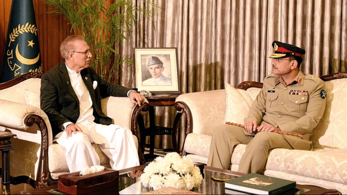 Lieutenant General Asim Munir, who was appointed as the new Chief Of Army Staff (COAS) of Pakistan, meets with President of Pakistan Arif Alvi, at the President House in Islamabad, Pakistan November 24, 2022. Press Information Department (PID)/Handout via REUTERS